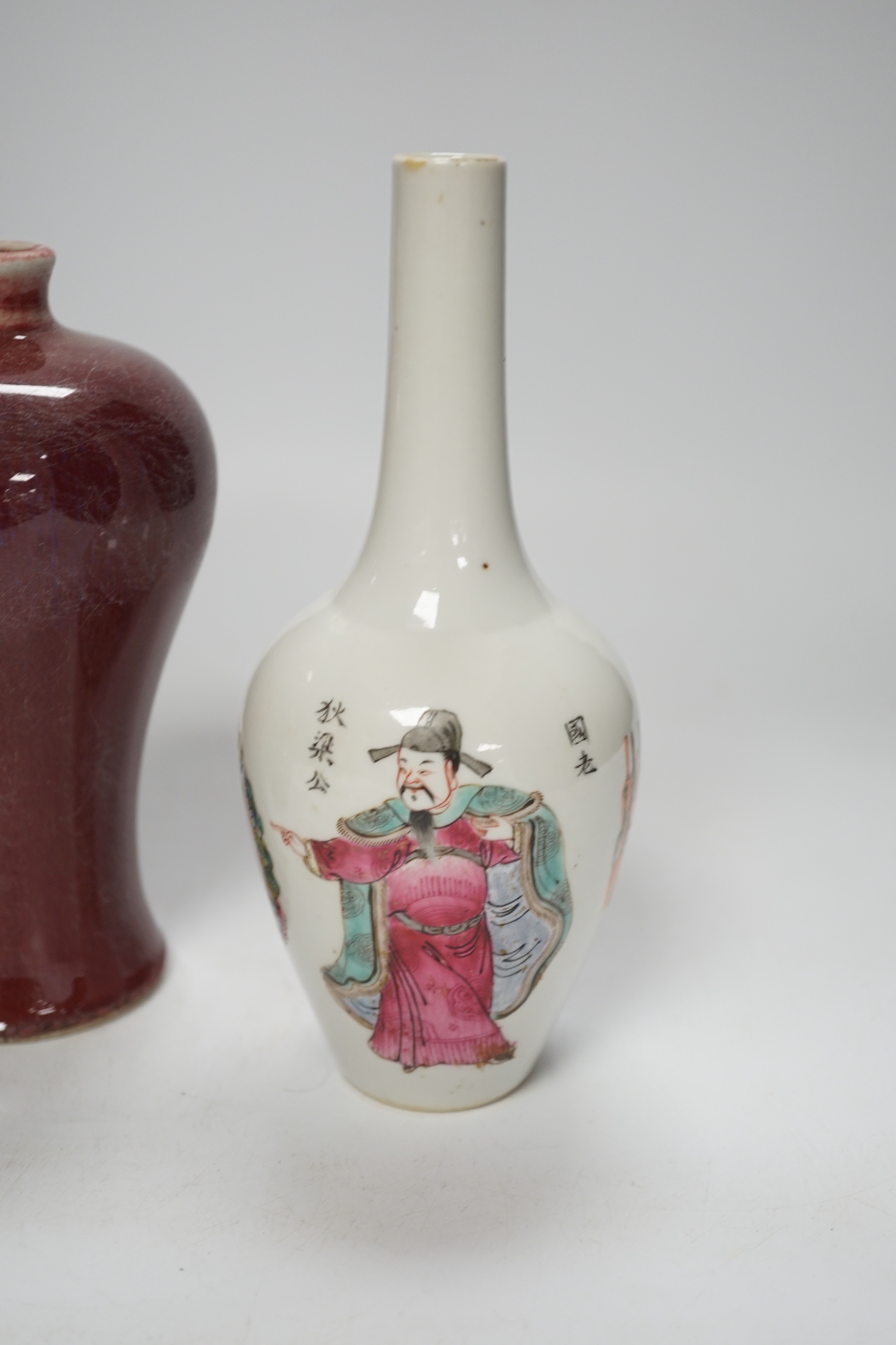 A Chinese double gourd vase, a sang de boeuf vase and a famille rose vase, 18cm high